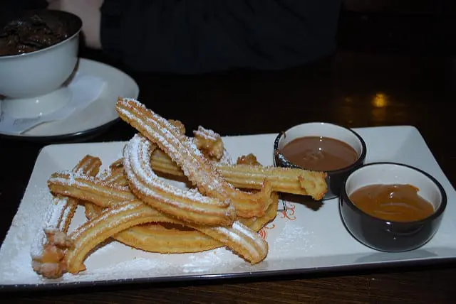 Churros served with dulce de leche are like doughnouts
