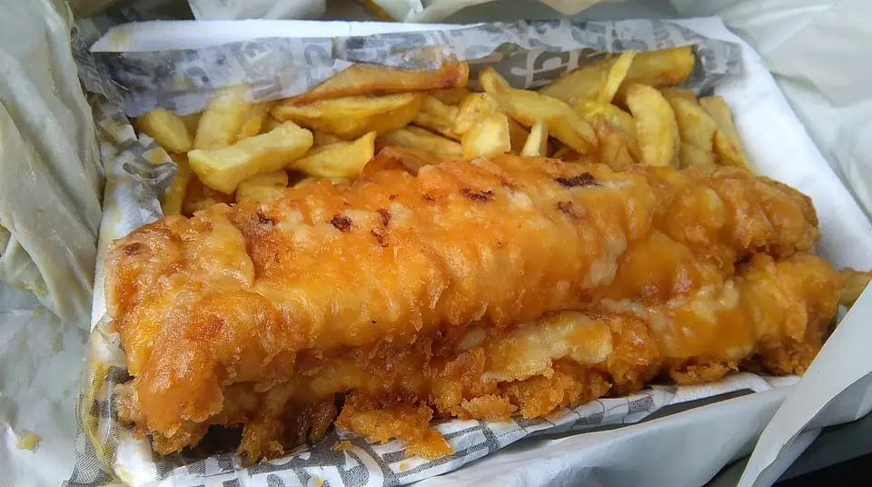Typical British fish and chips in newspaper as eaten in the UK