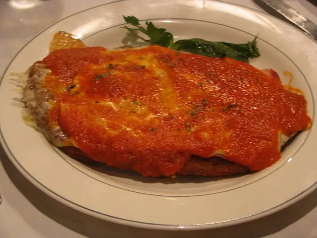 Milanesa a la Napolitana, a pizza-like dish inspired by Italian cooking