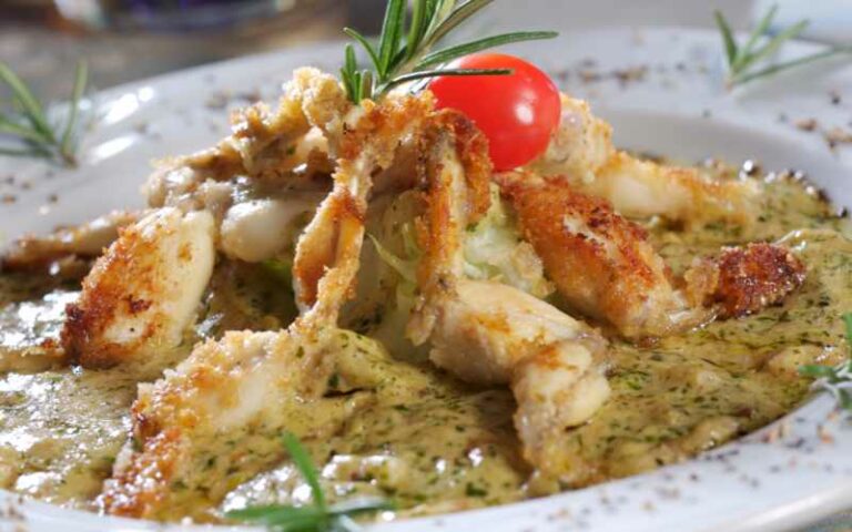 Frogs legs in a garlic and parsley sauce