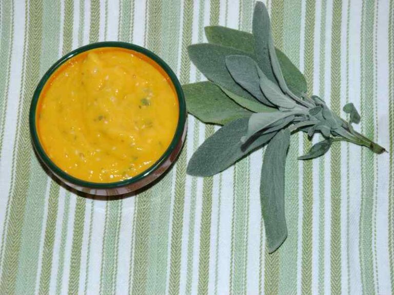 Yellow amba sauce in small dish