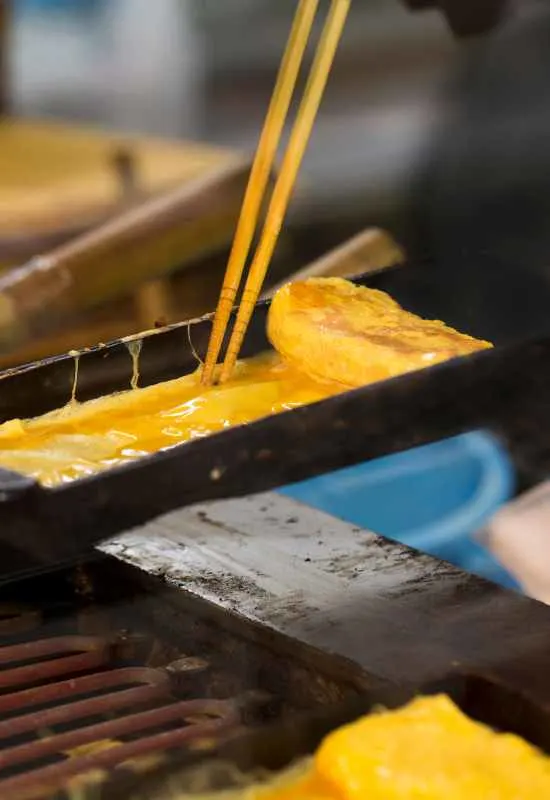 Tamagoyaki being cooked in pan