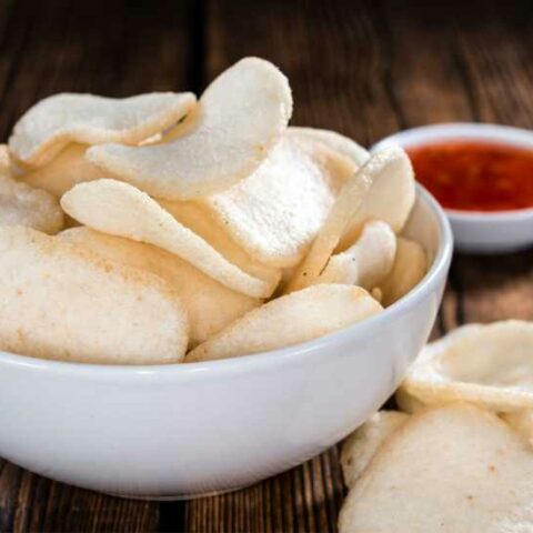 Shrimp chips prawn crackers in bowl with dipping sauce