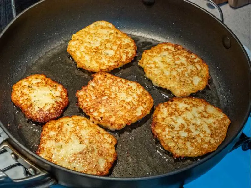 Potato pancakes being cooked