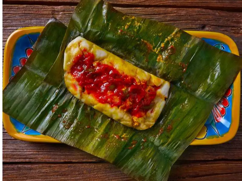 Tamal Pisque served with sauce