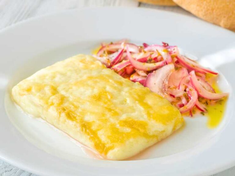 Cheese saganaki served with red onions.