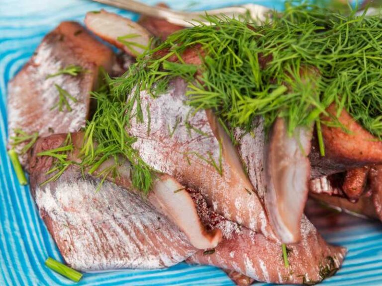 Pickled herrings served with dill.