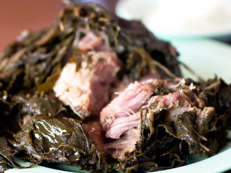 Pork wrapped in taro leaves.