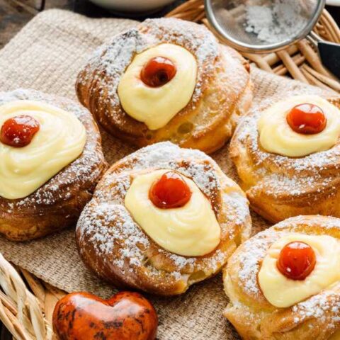 Zeppole Di San Giuseppe with red cherries