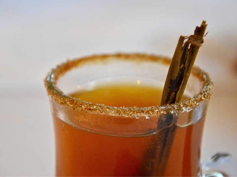 Canelazo served with cinnamon sticks