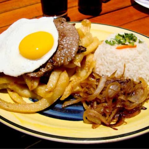 Bistec a lo pobre with white rice.