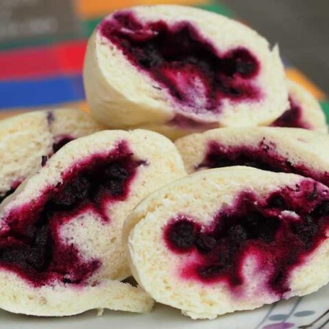 Dumplings filled with blueberries, no toppings.