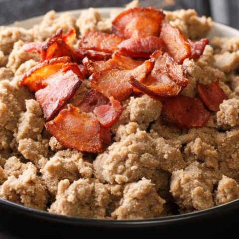 Zganci topped with bacon.