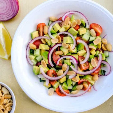 Salad with avocado, lemon, peanuts.