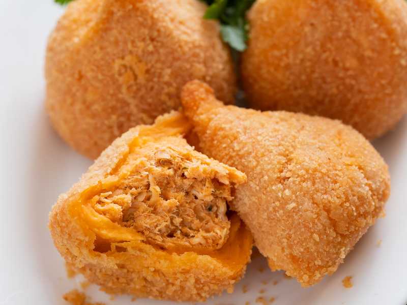 Coxinha filled with shredded chicken.